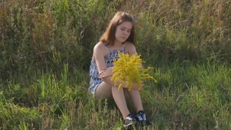 Sweetie fingers the pussy by the lake and reaches a fine orgasm
