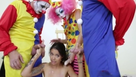 Clowns Penis-wises Play With a Brunette Chick Inserting Their Cocks in Her Holes in a